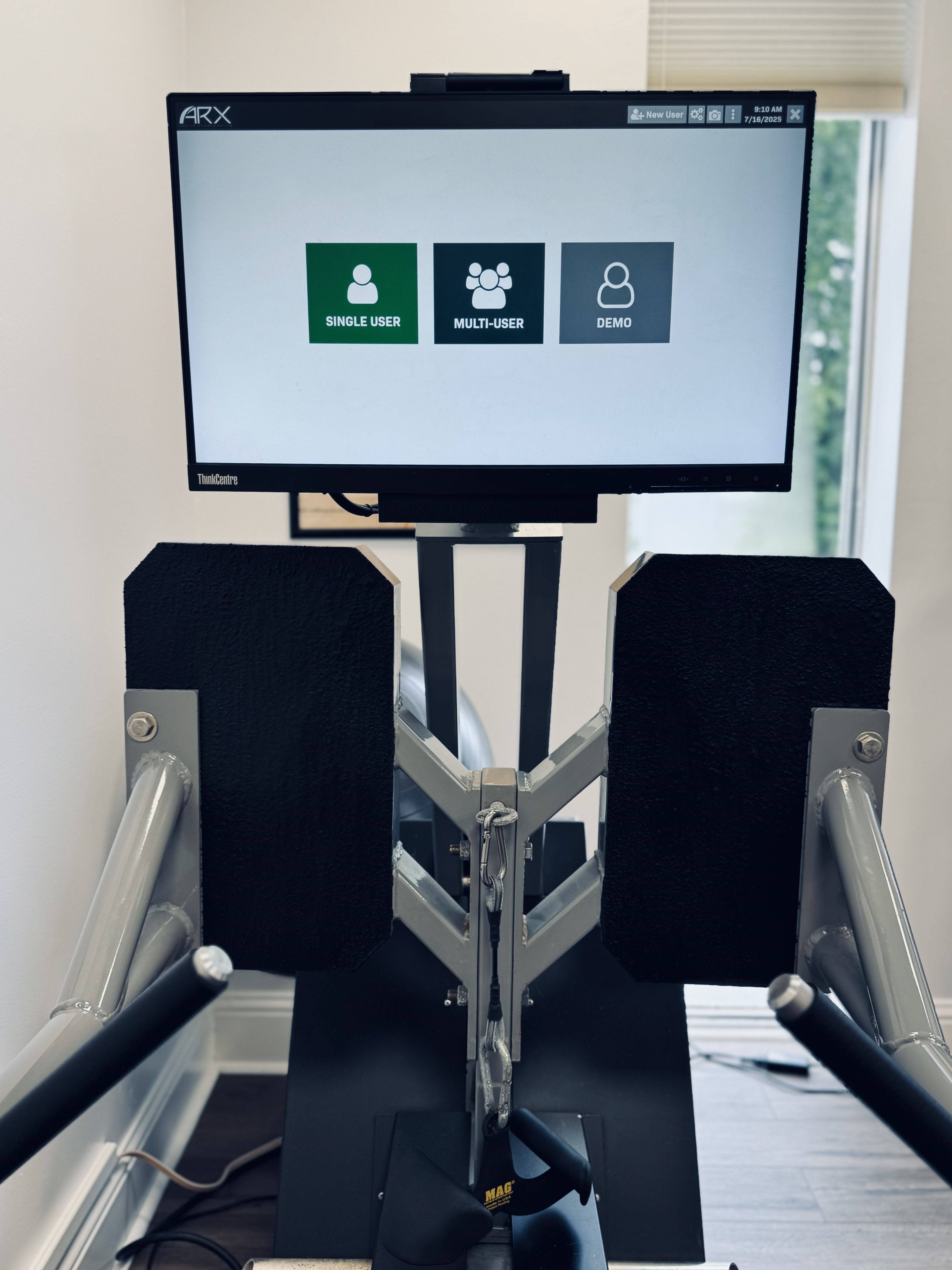 Coach guiding client on ARX Alpha at Lab Fit