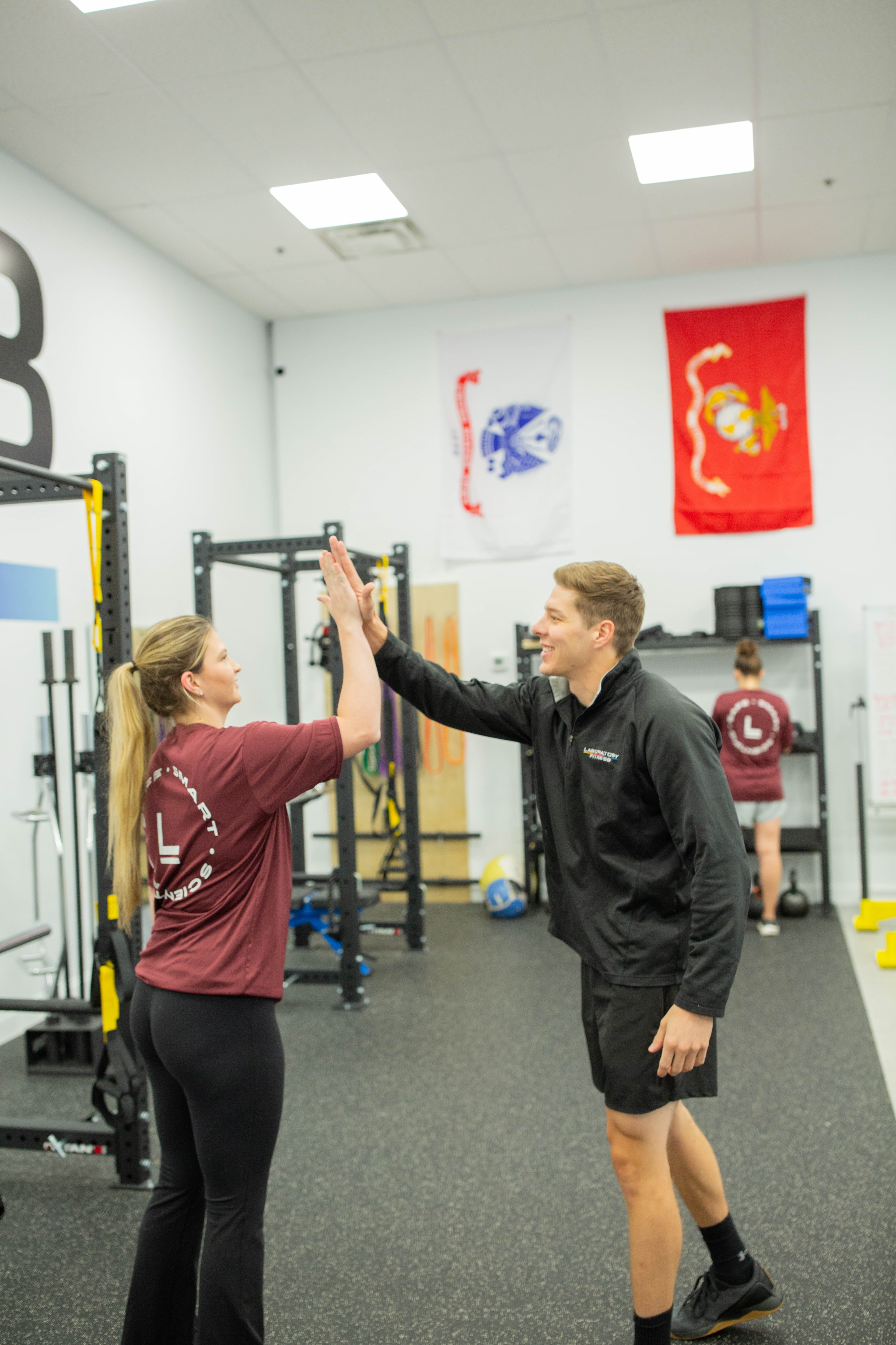 Coach and client celebrating progress at Lab Fit